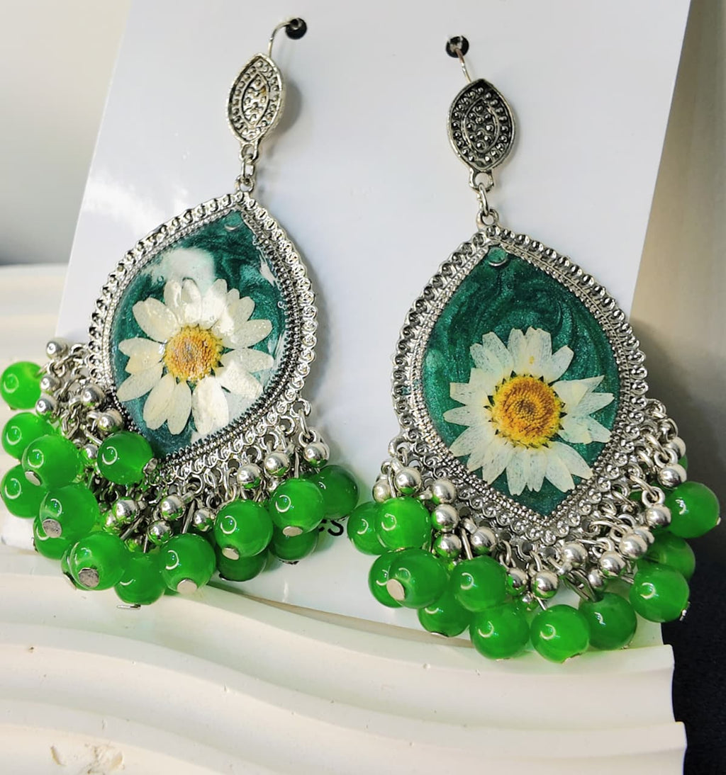Silver Base Green Resin Jhumka with White & Yellow-Green Desi Flowers and Silver-Green Hangings – Signature Artisan Design
