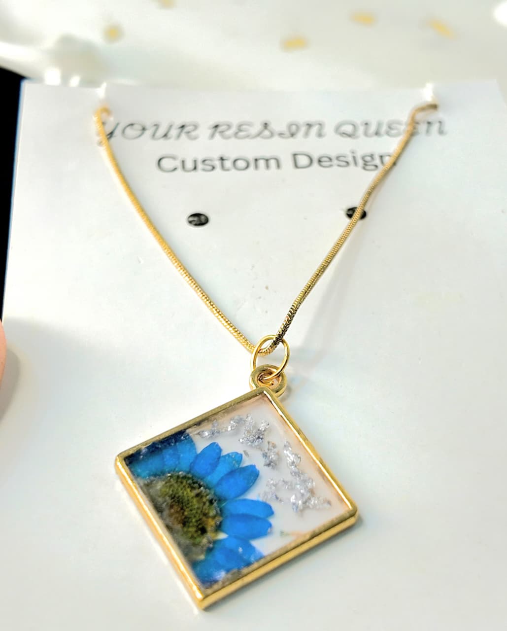Gold Base Pendant with Blue Desi Flower, Silver Flakes & Gold Chain – Artisan Elegance