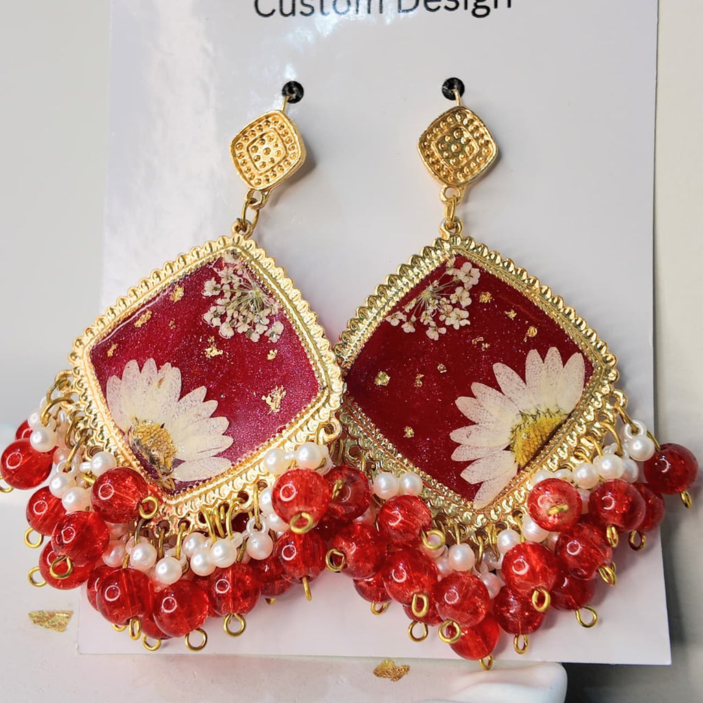 Gold Base Red Resin Jhumka Set with White Desi Flower & Gold Flake Highlights – Signature Design
