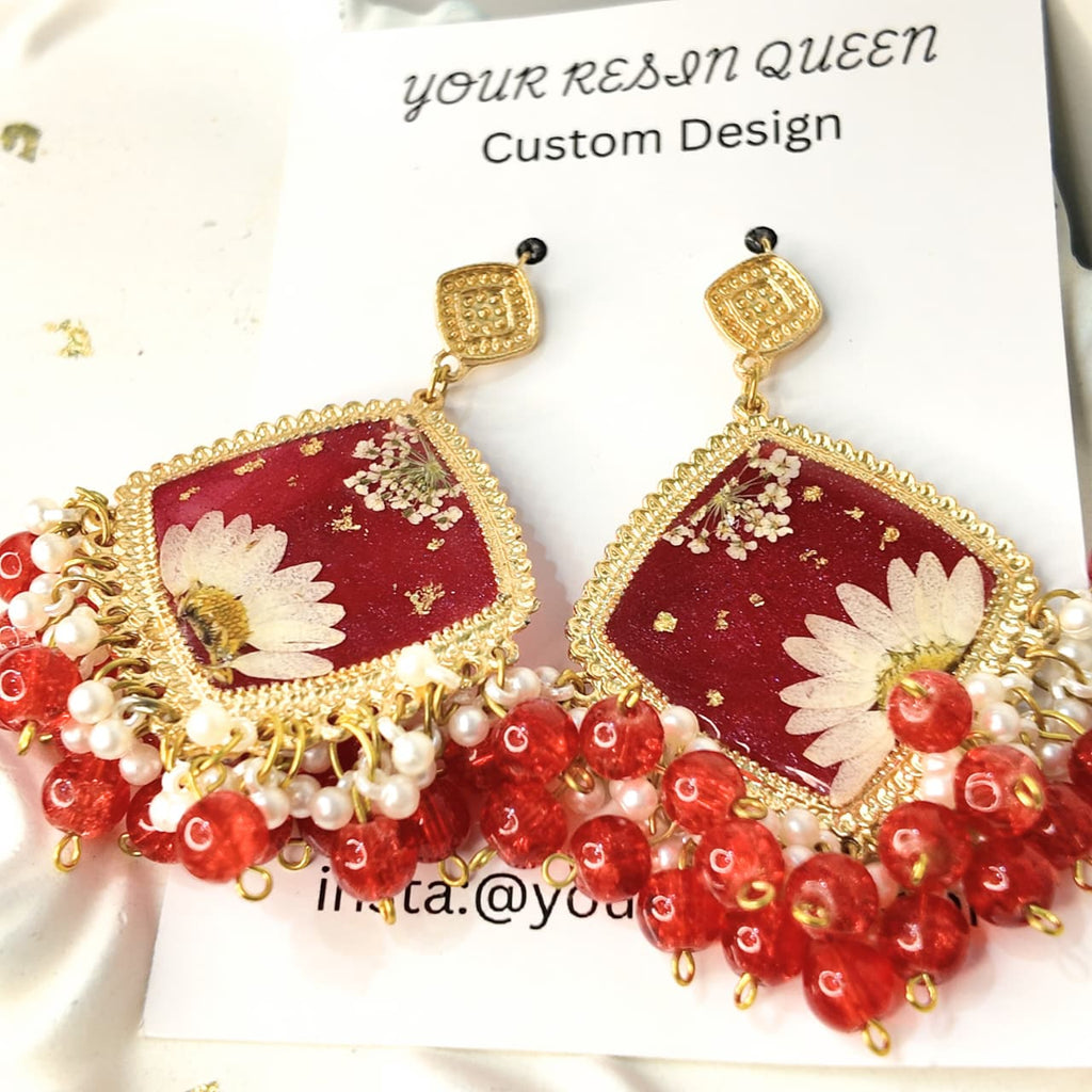 Gold Base Red Resin Jhumka Set with White Desi Flower & Gold Flake Highlights – Signature Design