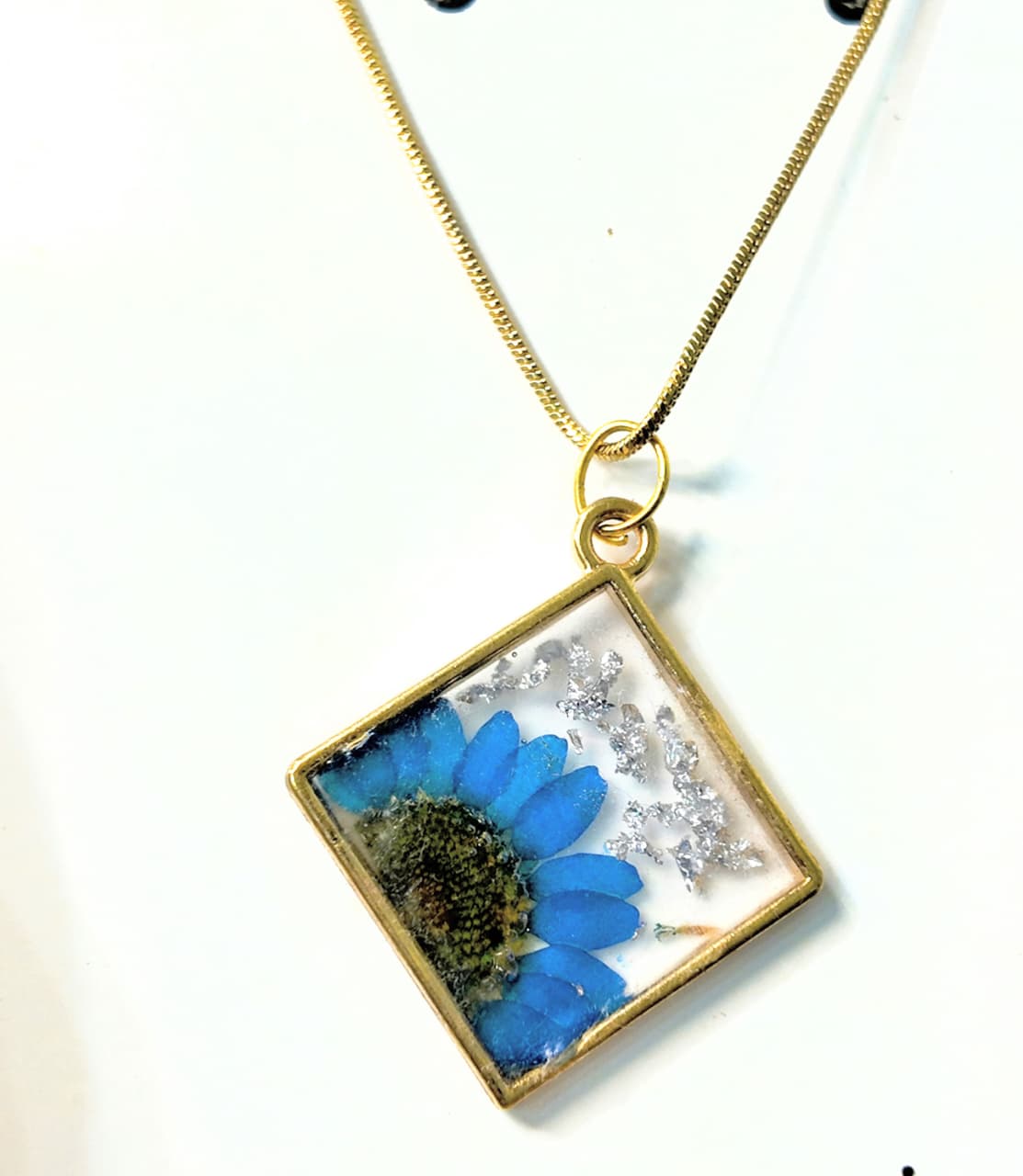 Gold Base Pendant with Blue Desi Flower, Silver Flakes & Gold Chain – Artisan Elegance